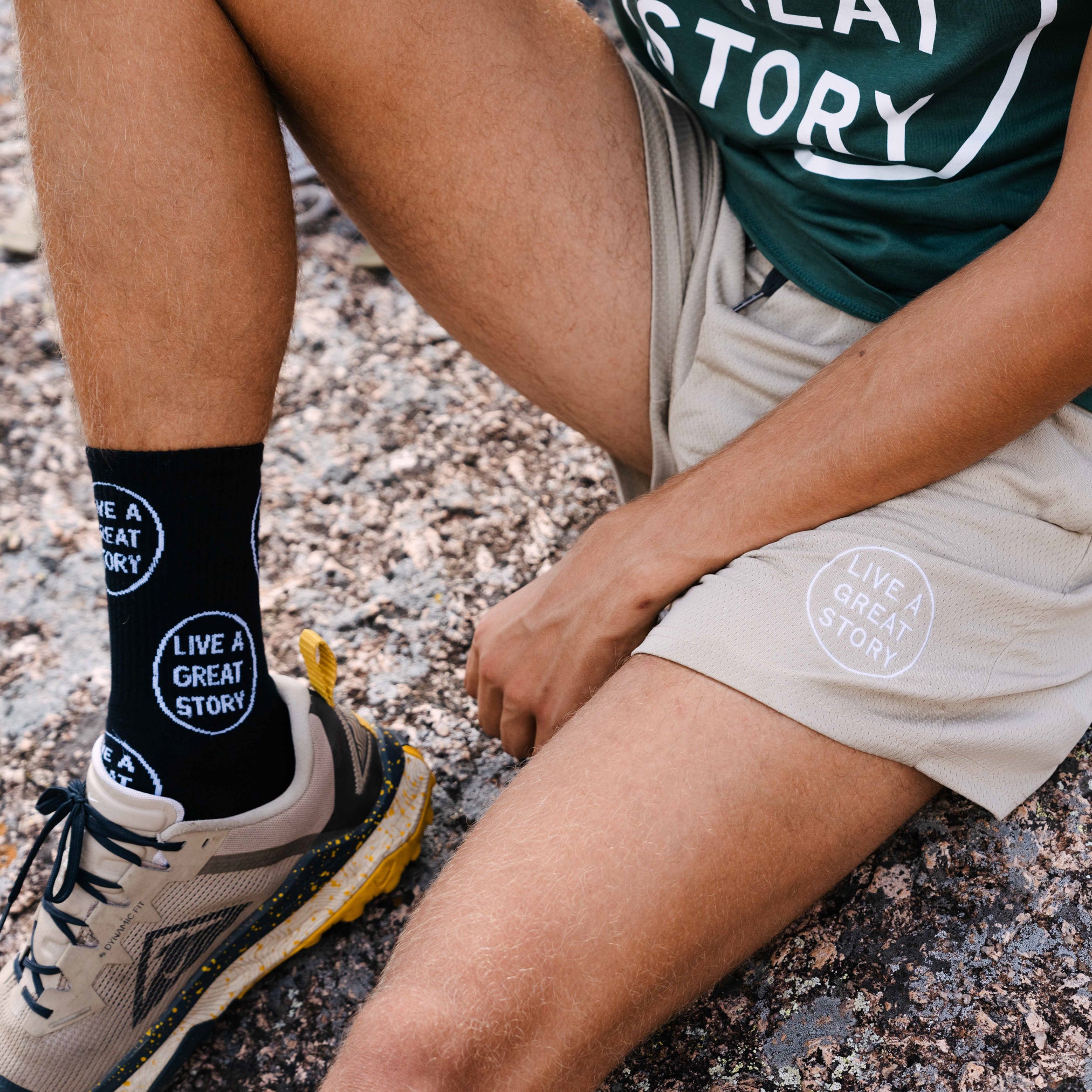 A man wearing light brown LIVE A GREAT STORY Men's Summer Shorts and socks
