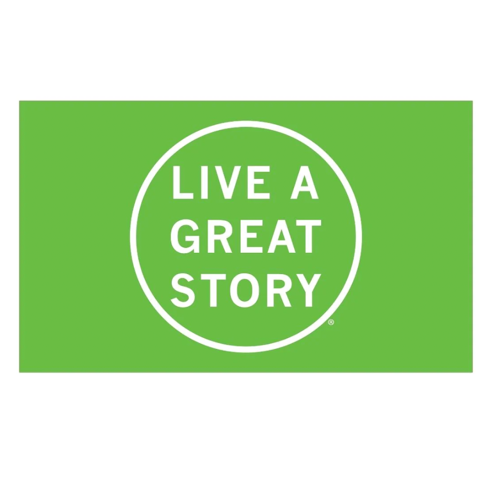 A green LIVE A GREAT STORY Mini Adventure Flag