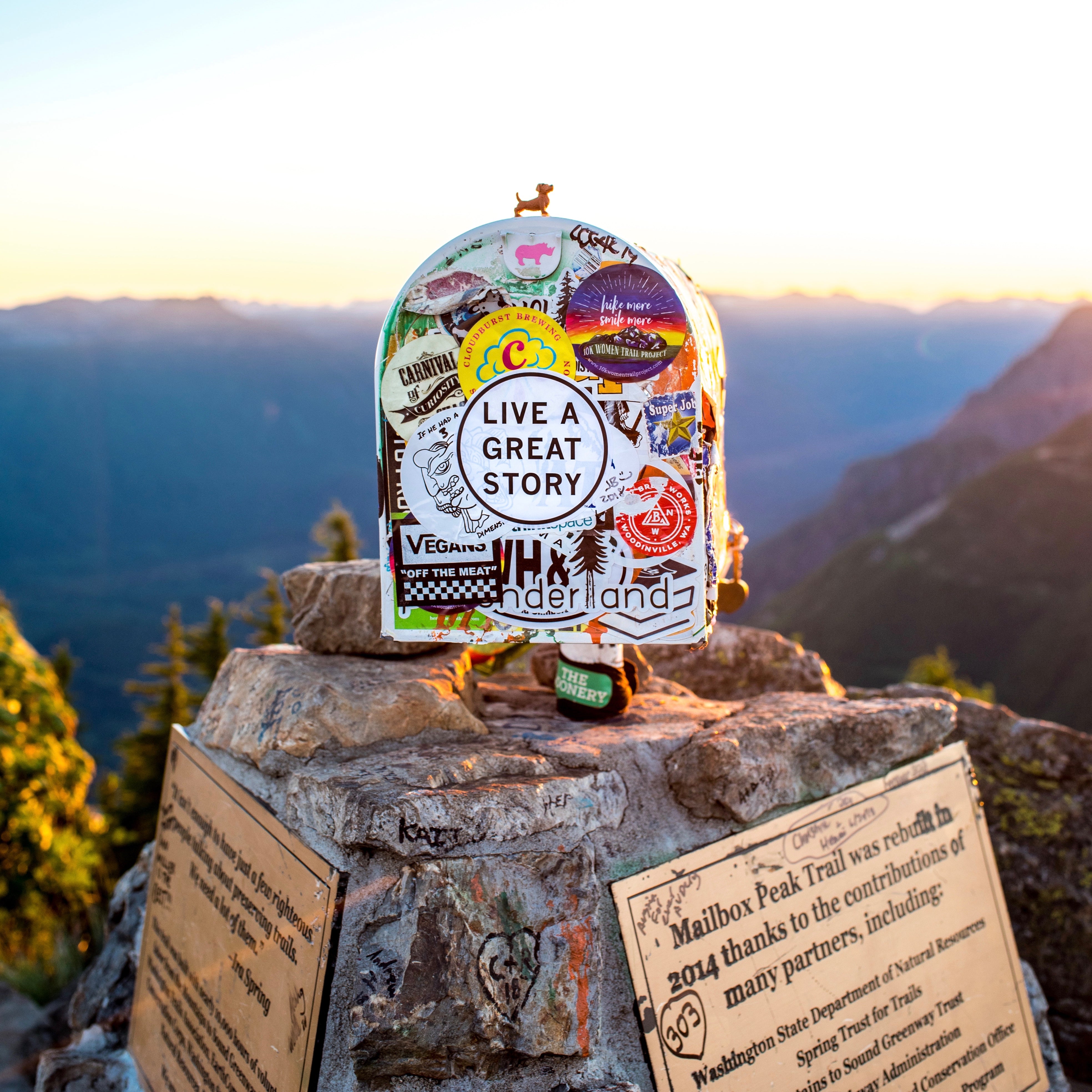 A LIVE A GREAT STORY sticker at a lookout point