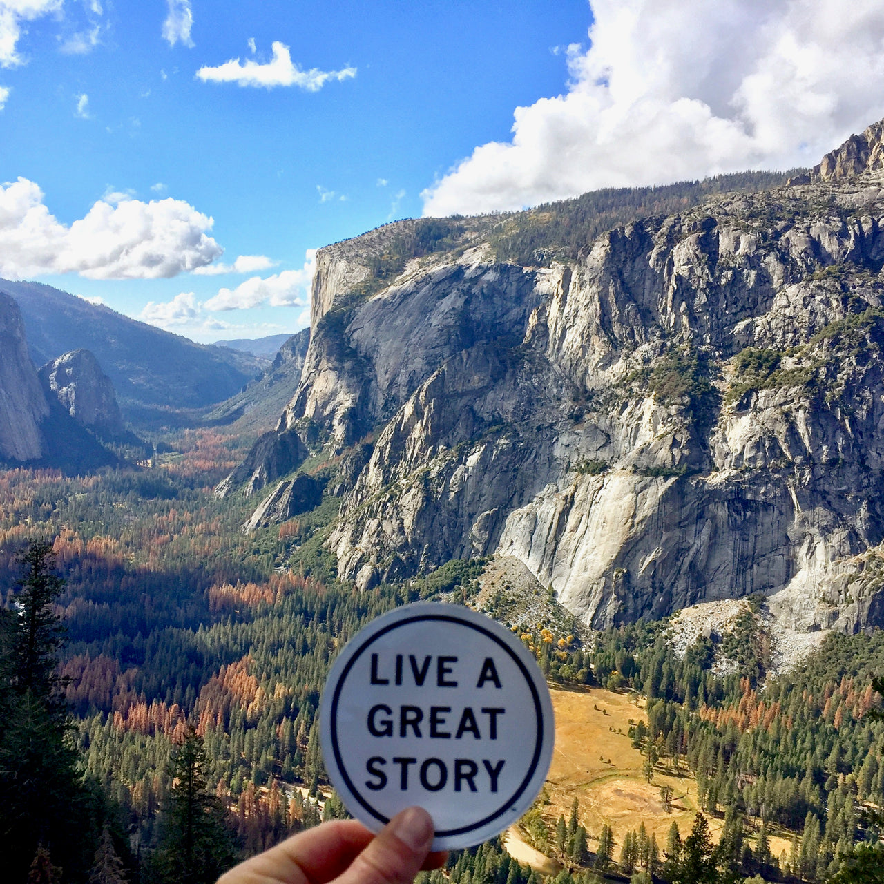 A LIVE A GREAT STORY Inspirational Sticker with a view in the background